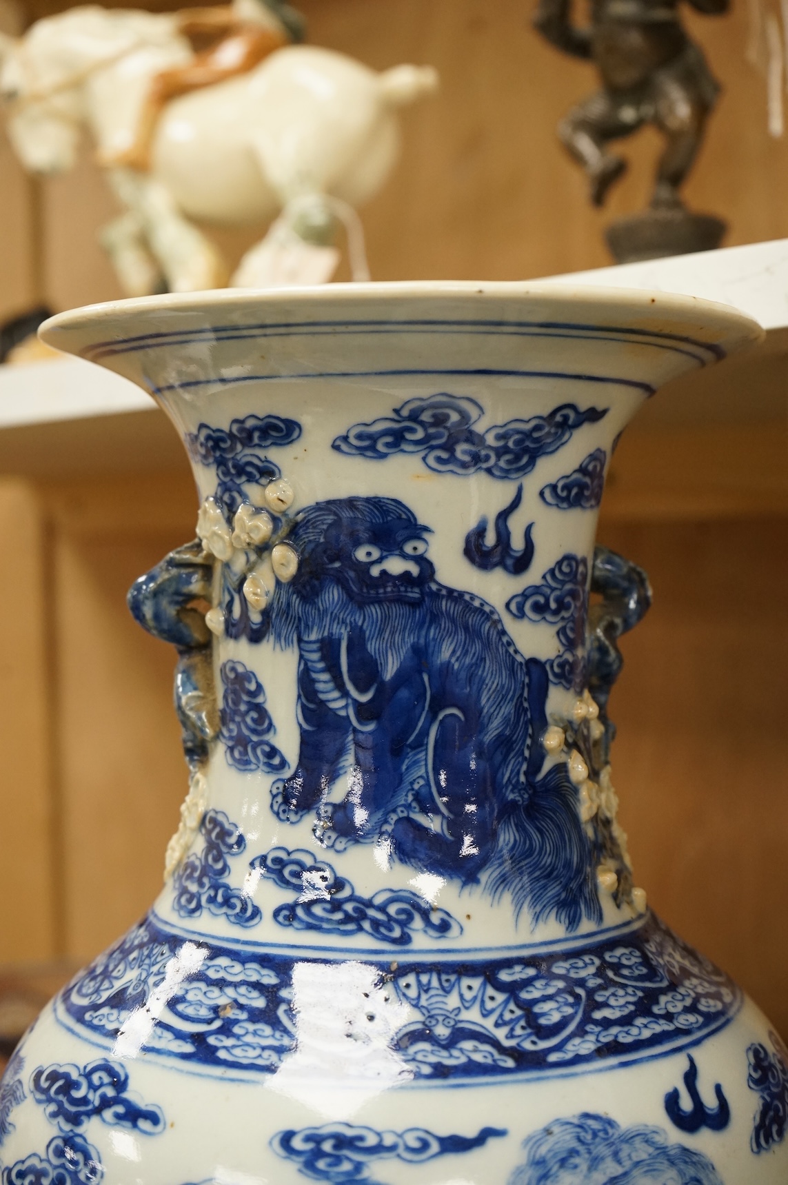 A Chinese baluster vase, painted with Buddhist lions in underglaze blue, 45cm high
